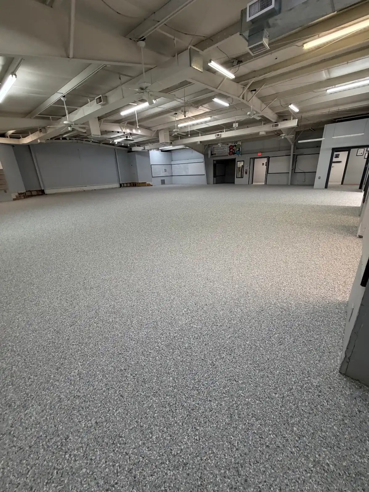 Commercial flake floor coating with pass-through room